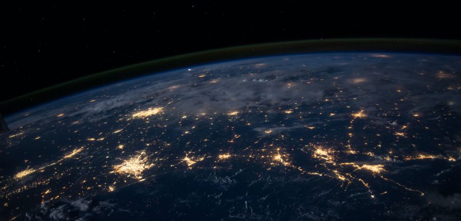 top half of earth at night with lights 